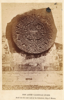 The Aztec calendar stone, photograph, page, inscription: 'Built into, City of Mexico.', Mexico