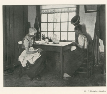 Two women sitting at a table doing needlework, page, photomechanical print, photographer: LL