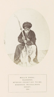 Portrait of Mullik Ensal, a man with a rifle from the Wazir tribe of Kohat, Khyber Pakhtunkhwa,