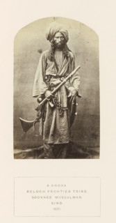 Portrait of an unknown man with a rifle from the Khosa Baloch tribe in Sindh, Pakistan, photograph,