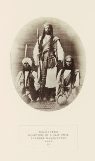 Portrait of three unknown men with weapons from the Brahui community of Kalat, Balochistan,