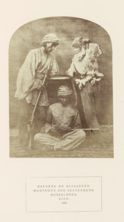 Portrait of three unknown hunters from Sindh, Pakistan, with a dead bird and rifles, photograph,