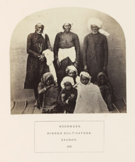 Portrait of eight people and children from the Kurmi community of Sagar, Madhya Pradesh, India,