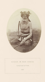 Portrait of an unknown man in his warrior clothes from the Khond tribe in Odisha, India,
