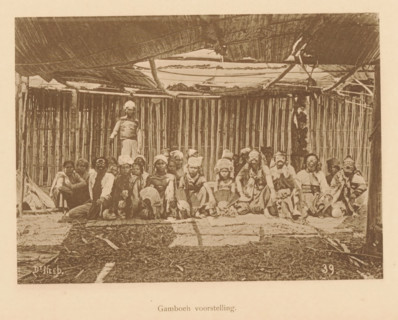 Portrait of unknown persons in costume, some with masks, Gamboeh scene, page, photomechanical