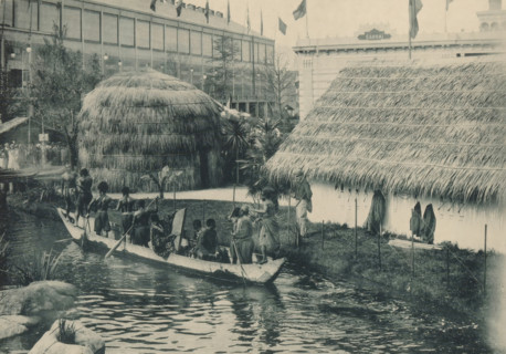 Congo, Vue du Village, Men in a rowing boat in a recreated Congolese village at the Antwerp World