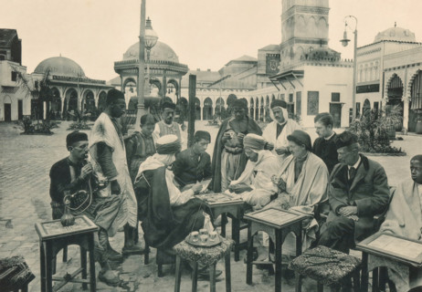 Tunisia, Partie de Cartes devant un Café arabe, Group of men playing a card game on a square in the