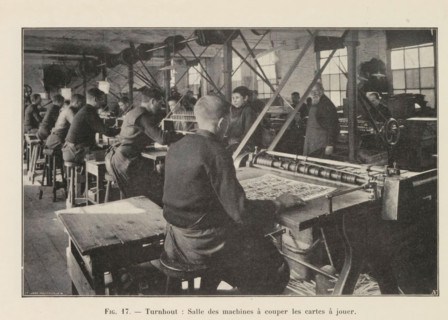 Men cut out printed playing cards in a printing house in Turnhout, page, photomechanical print,