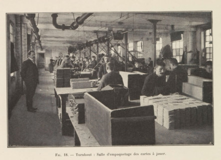 Men pack printed playing cards in a printing house in Turnhout, page, photomechanical print,