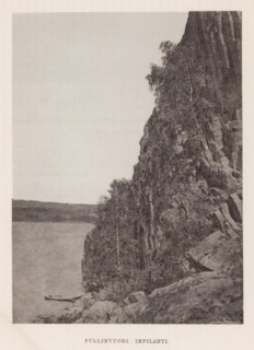 Rock wall on a body of water with an empty canoe, Pullinvuori Impilahti, page, photomechanical