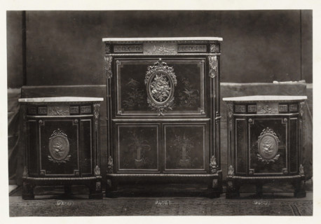 Secretary and two triangular corner pieces of furniture decorated with medallions and plant motifs,