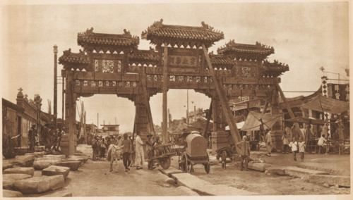 Street view with paifang, page, photomechanical print, photographer: Donald Mennie, Beijing, cliché