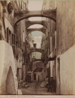 Street view with some people in San Remo, Italy, Vicolo del Giuoco della Palla, Sanremo,
