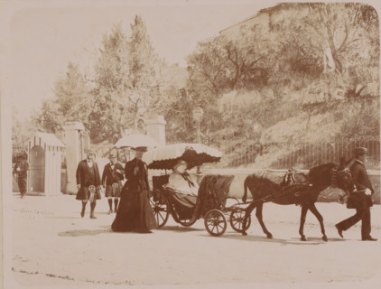 Queen Victoria in her carriage in a park, France ?, photograph, with staff and two guards.,