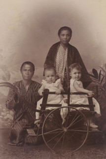 Portrait of two children, presumably the children of AF Marmelstein, with two servants, cabinet
