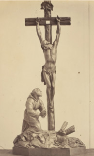 Palm wood crucifix from the collection of CJ Vervloet in Brussels, displayed at an exhibition on