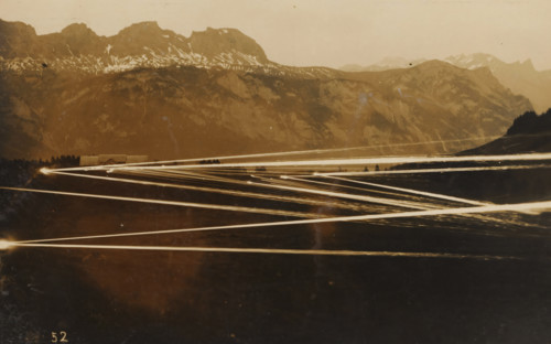 Barrage with machine gun(s) at evening or night, photograph, number: '52', name: 'PHOTO WIDMER,
