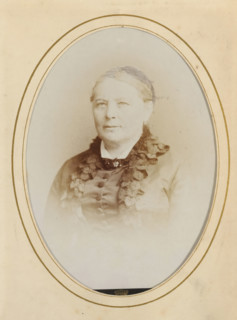 Portrait of a woman, album page, photograph, cabinet photograph, This photo is part of an album.,