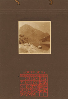 Three women, a man and two children on rocks on the coast, with a mountain in the background, album