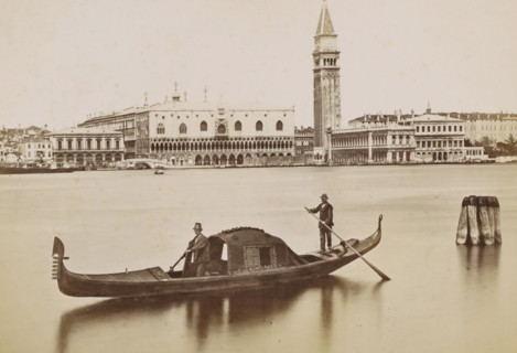 View of the Doge's Palace, the Campanile and surrounding buildings in Venice with a gondola in the