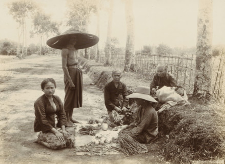Indonesian women and man with displayed vegetables along the side of the road (former title), Women