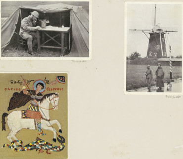 Soldiers in rain gear and a dog in front of a windmill, album page, photograph, postcard, Part of