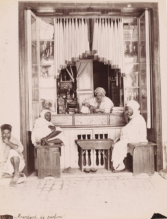 Perfume merchant, Perfume seller in his shop, presumably in Tunis, photograph, number: 'N. 44.',