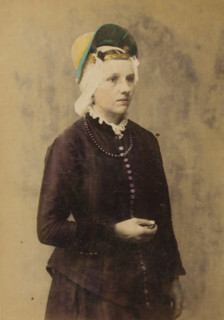Portrait of an unknown woman with a headdress in the traditional costume of Zaandam, North Holland,