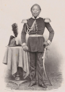 Portrait of Youda Negara, Prince of Djoejocarta, print, The sitter stands next to a table with a