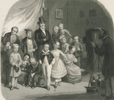 Family posing for a group photo, print, album page, Print is part of an album. Print is loose in