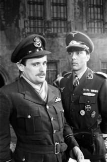 Actors David McCallum (left) and Anthony Valentine on the film set during filming of 'Colditz', the