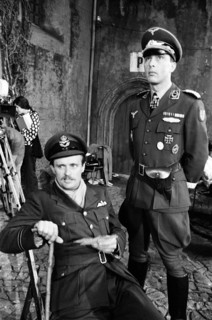 Actors David McCallum (left) and Anthony Valentine on the film set during filming of 'Colditz', the