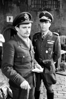 Actors David McCallum (left) and Anthony Valentine on the film set during filming of 'Colditz', the