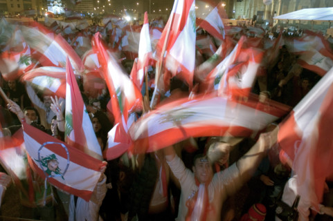 Lebanese protestors celebrate victory at Martyr's Square in Beirut