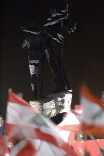 Lebanese protestors celebrate victory at Martyr's Square in Beirut
