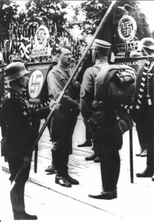 Hitler consecrating the new flags of the Reich