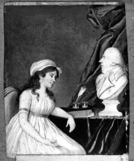 Woman seated before the bust of her husband