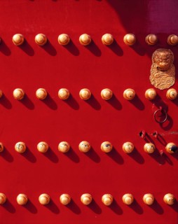 The knob on the red painted gate of the Forbidden City,Beijing,China