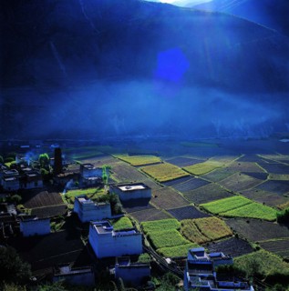 the field and cottages in Derong County,Sichuan Province,China