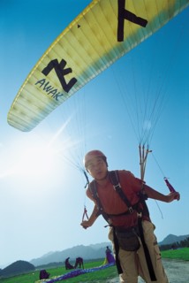 A man prepares to glide(China)