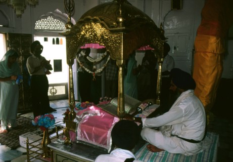 A priest reads from the Guru Granth Sahib in the Akal Takht, inner sanctum of the Golden Temple in Amritsar