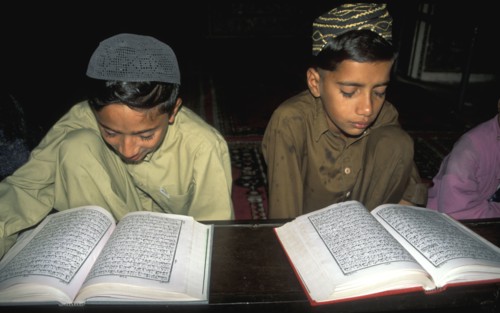 Young Pakistani boys reading the Quran