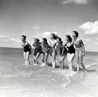 Marquis de Cuevas' company on the beach at Deauville: 7 girls, 7 nationalities