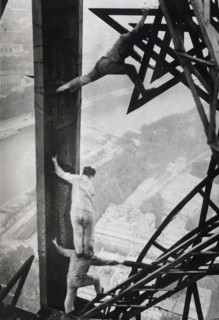 Acrobat electricians working on the Eiffel tower