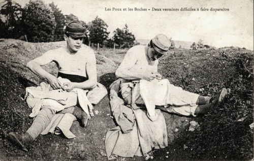 Couple of 'Poilus' taking out their lice in the Trench