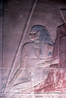 Spouse seated at the foot of the Master of the manor