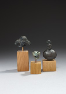 Têtes de statuette et poids