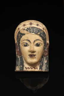 Antéfixe à visage féminin