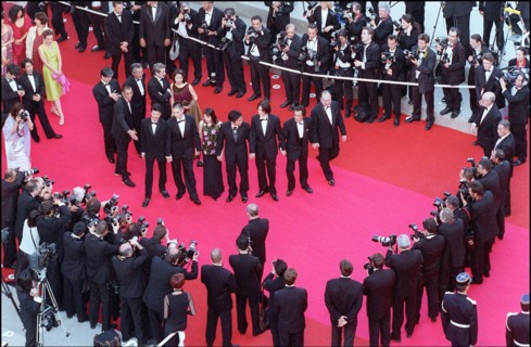05/09/2001. 54th Cannes Film Festival: Francis Huster walking up the stairs.