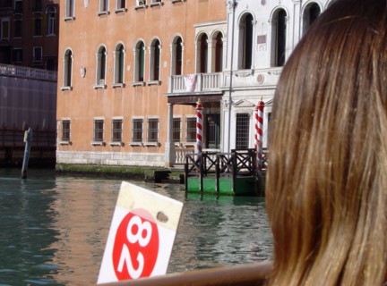 A strawberry blonde before Palazzi Cappello Layard and Grimani Marcello in Venice